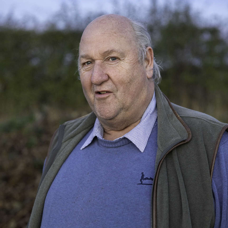 Photo of Michael Wilton at a field boundary